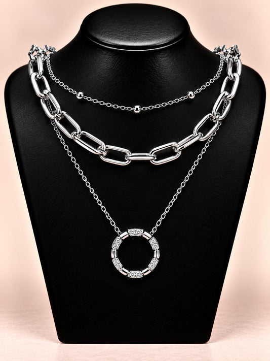 Collar triple plateado con dije aro segmentado de circonias